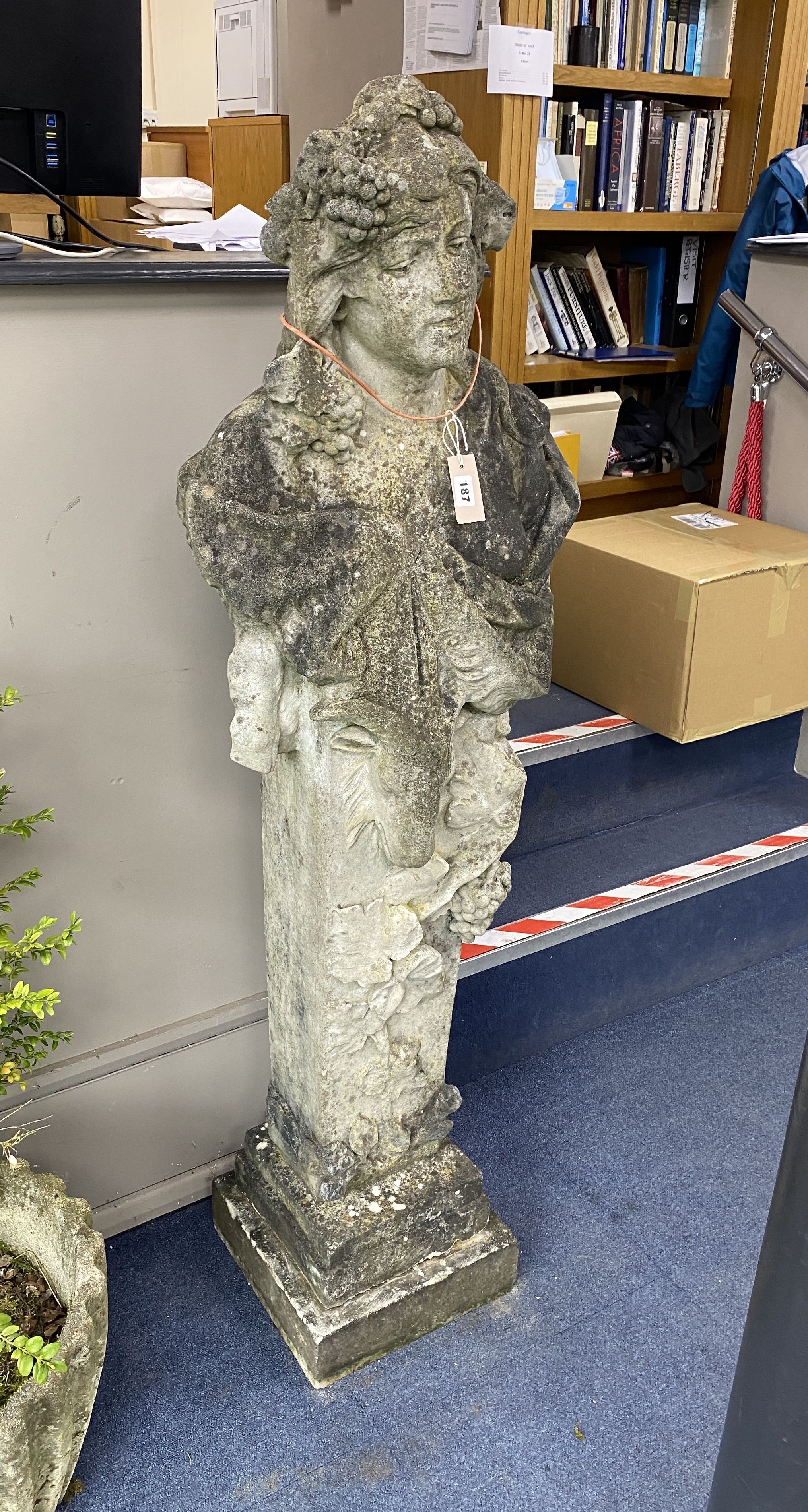 A reconstituted stone figure of a term, on a stepped square plinth, height 156cm